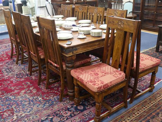A large dining table and ten chairs, W.240cm